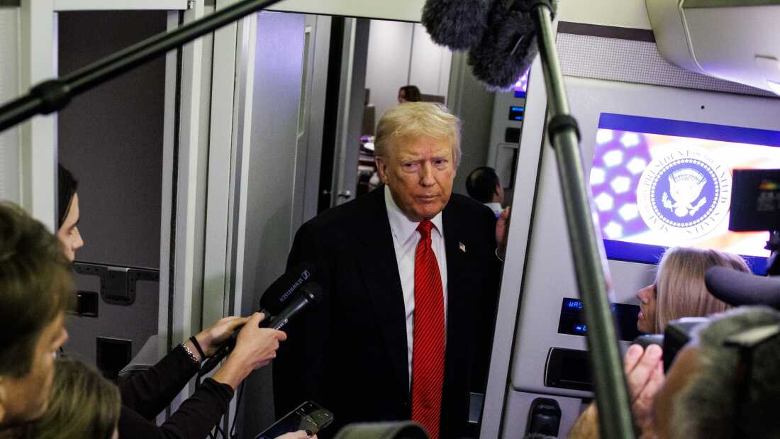 President Trump signs an executive order related to trade policy.